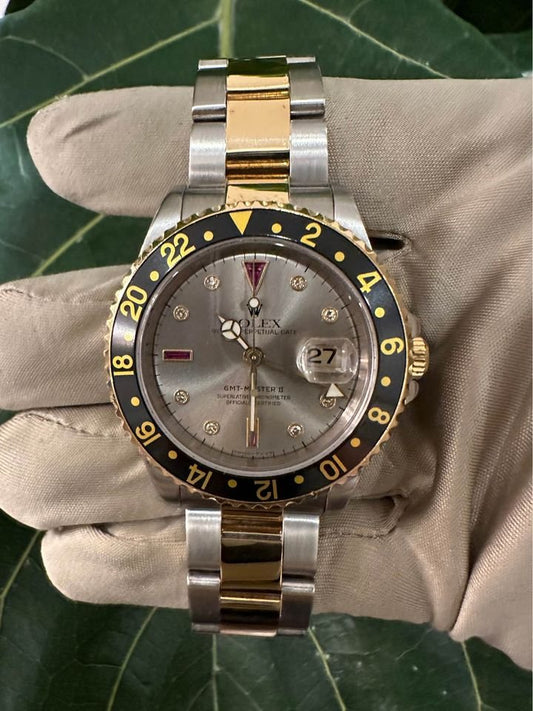 2005 Rolex GMT Master-II 16713 Grey Serti Diamond Ruby Dial TT Oyster - MyWatchLLC